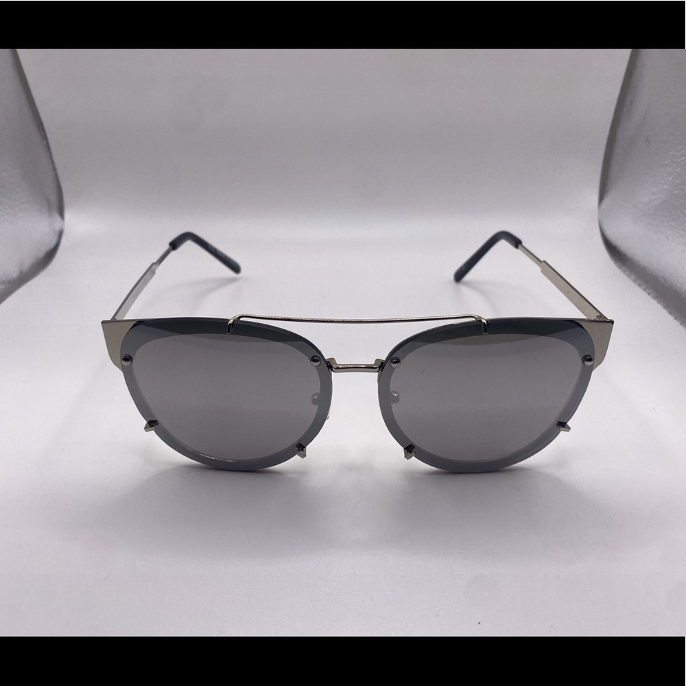 Woman’s large black sunglasses
